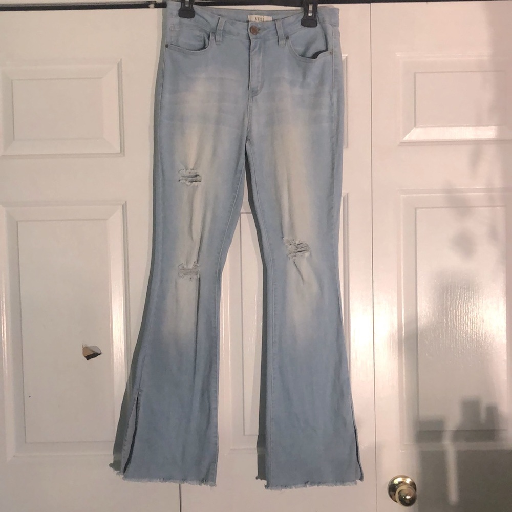 Light blue high rise ripped flare jeans